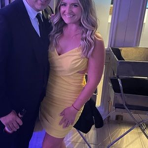 Yellow open back dress from These Three Boutique